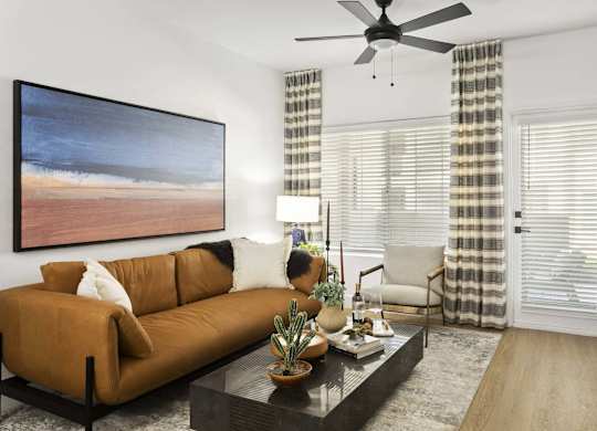 A living room with a brown couch, a coffee table, and a painting on the wall.