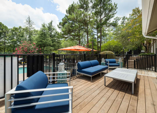 a patio with couches and a table
