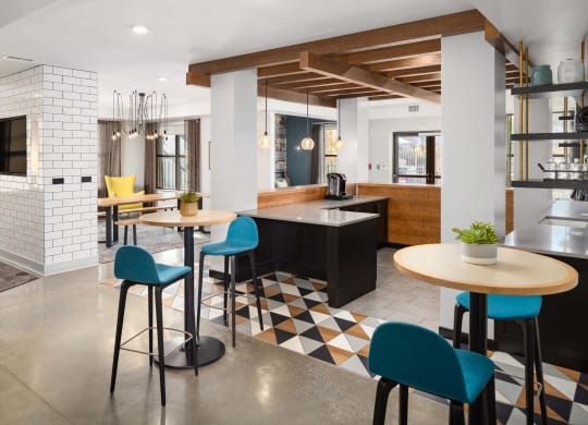 a kitchen and dining area with tables and chairs