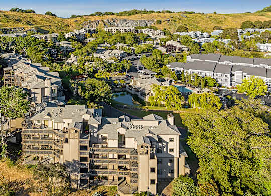 a aerial view of a city with buildings and trees