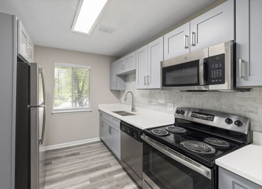 Kitchen with cabinets at The Madison at Adams Farm, Greensboro, NC