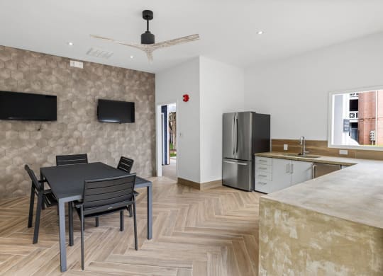 a dining room and kitchen with a table and chairs and a refrigerator at Mariners Crossing, Raleigh, NC