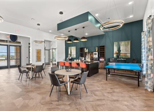 resident lounge with a ping pong table and a pool table