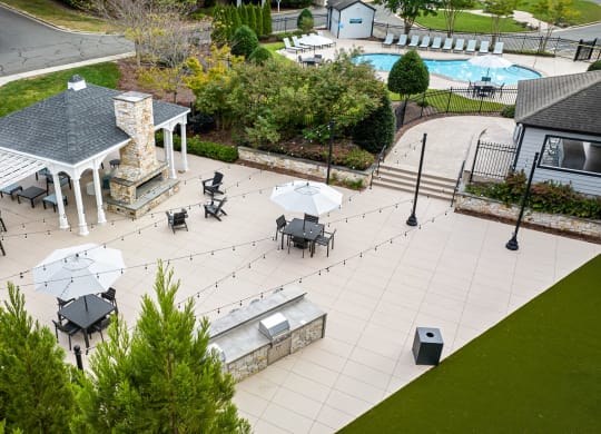 arial view of a patio with tables and umbrellas at View at Lake Lynn, Raleigh