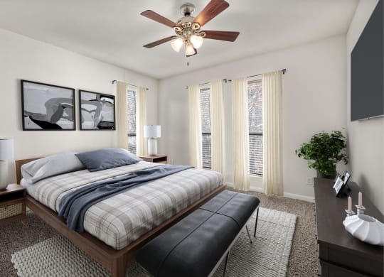 a bedroom with a bed and a ceiling fan