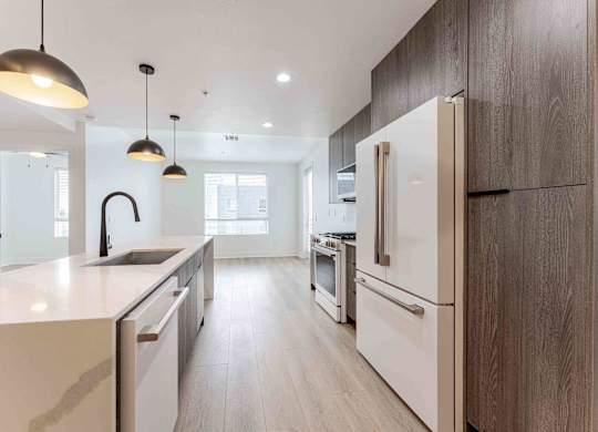 a kitchen with a sink and a refrigerator