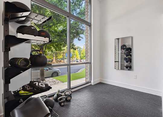 a room with a large window and white walls