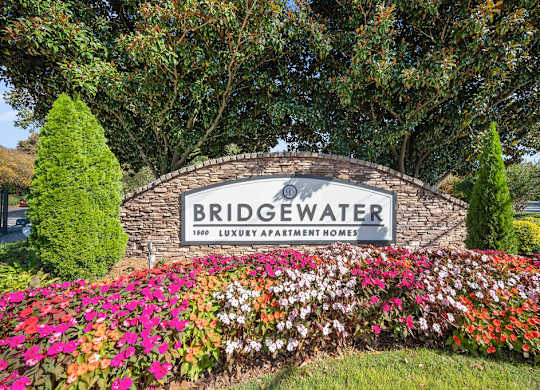 the sign for bridgewater at the entrance of the subdivision with flowers