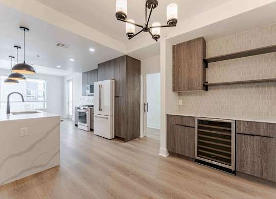a kitchen with wooden cabinets and a white refrigerator