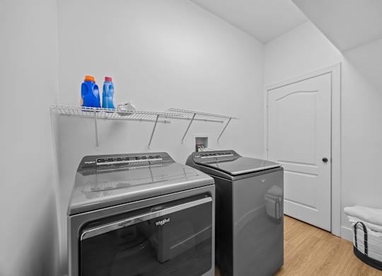 A laundry room with a washer and dryer.