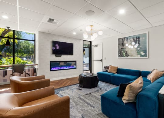 the preserve at ballantyne commons community living room with couches and a fireplace