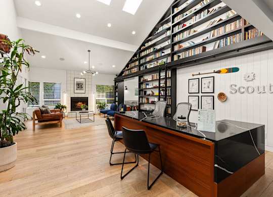 Modern office workspace with builtin bookshelves at Scout Apartments, Kirkland, WA