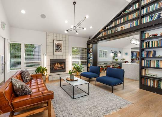 Modern living room with fireplace and built in bookshelf at Scout Apartments, Kirkland, 98034