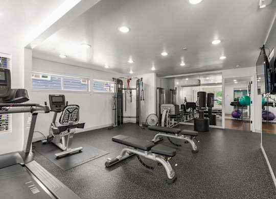 Fitness center with cardio and strength equipment at Scout Apartments, Washington