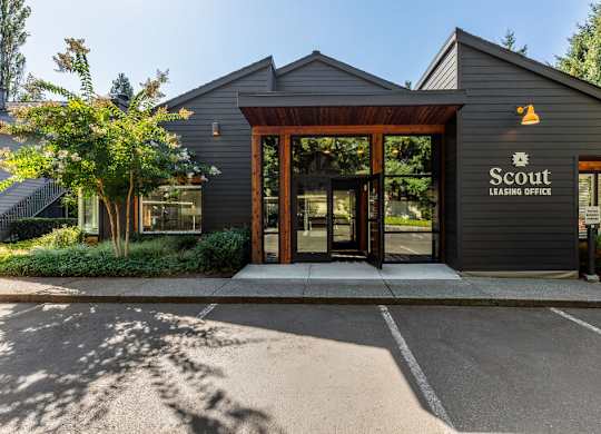 Leasing office entrance with wood framed glass doors at Scout Apartments, Washington