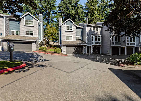 Townhome exterior with private garages at Hidden River Townhomes Apartments, Kirkland