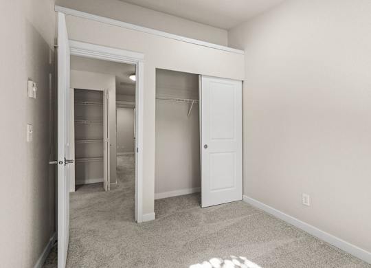 Bedroom with walk-in closet and storage space at Hidden River Townhomes Apartments, Kirkland, 98034