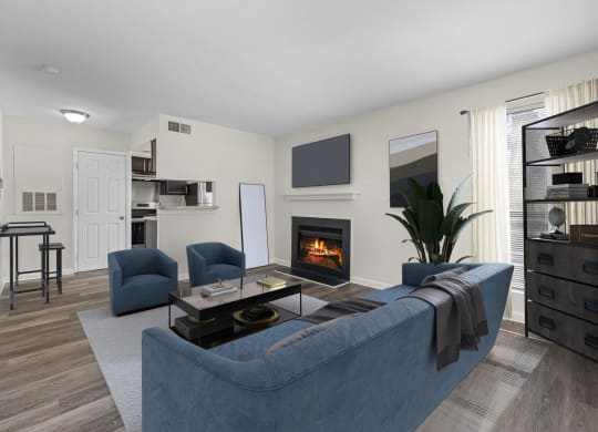 a living room with a blue couch and a fireplace