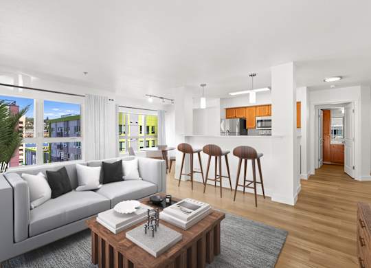 A modern living room with a grey sofa and a coffee table.