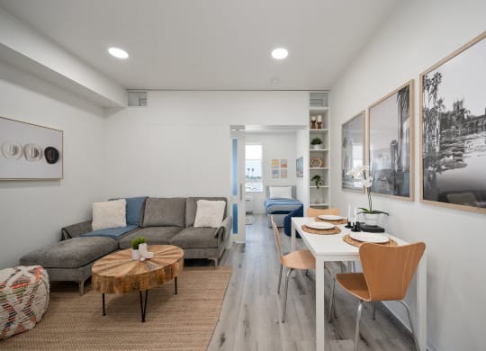a living room with a table and chairs and a couch