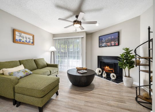 a living room with a couch and a chair and a fireplace at View at Lake Lynn, North Carolina