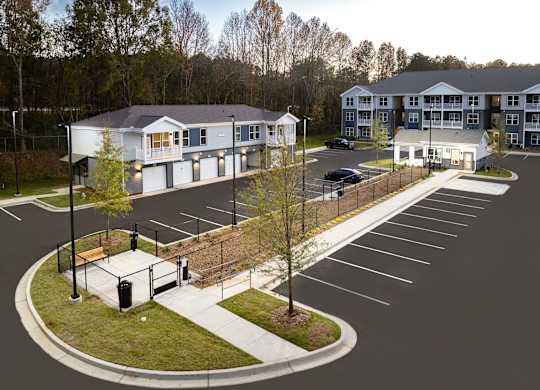 A parking lot with a building in the background.