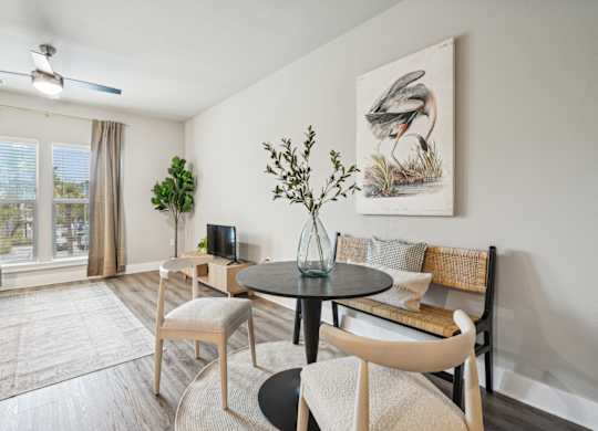 our apartments offer a living room and dining room with a table and chairs
