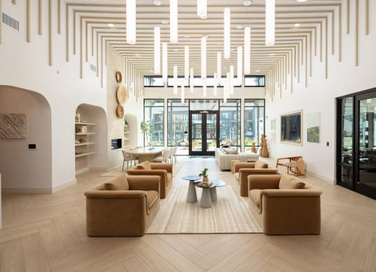 a living room with couches and chairs and a rug