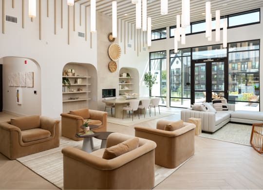 a living room with couches and chairs and a table
