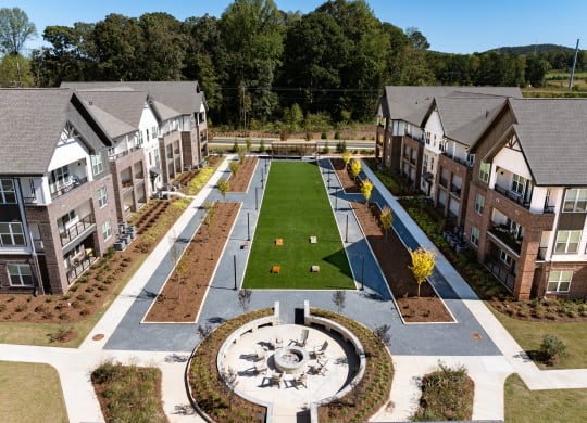 an aerial view of a yard in the middle of an apartment complex