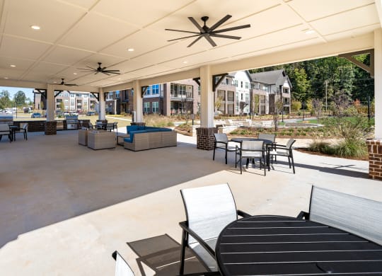 the preserve at ballantyne commons clubhouse patio with tables and chairs