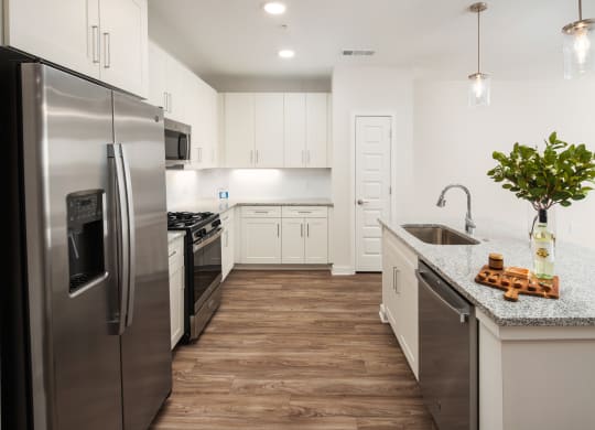 a kitchen with stainless steel appliances and a counter top
