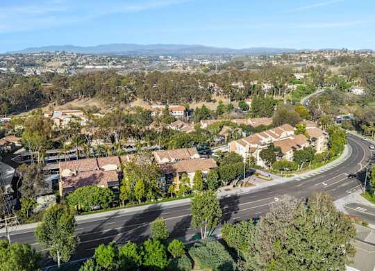 A residential area with houses and trees.