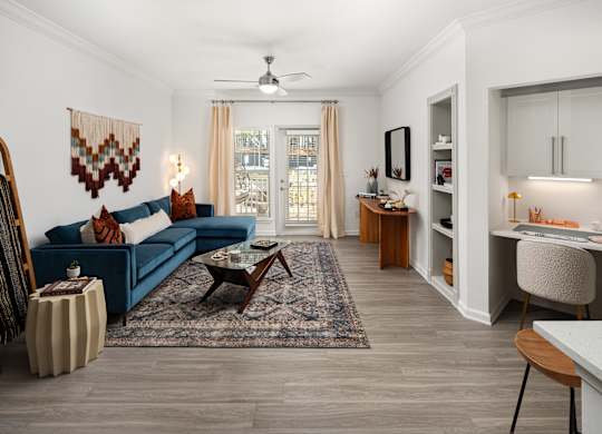 a living room with a blue couch and a coffee table