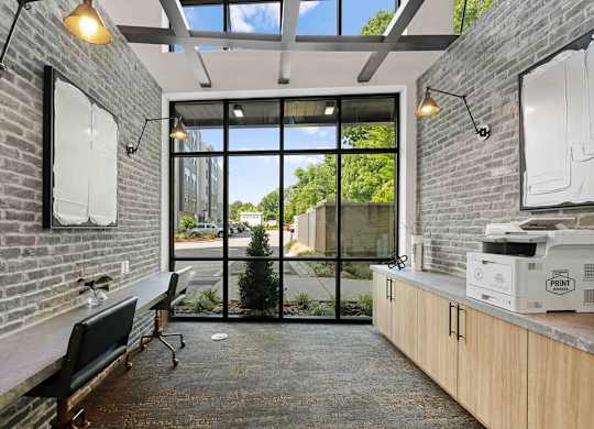A room with a brick wall and a glass door leading outside.