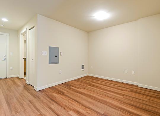 A room with wooden floors and a white ceiling.