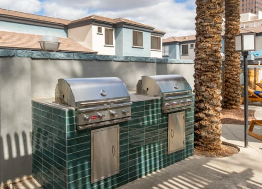 two bbq grills at the enclave at woodbridge apartments in sugar land, tx