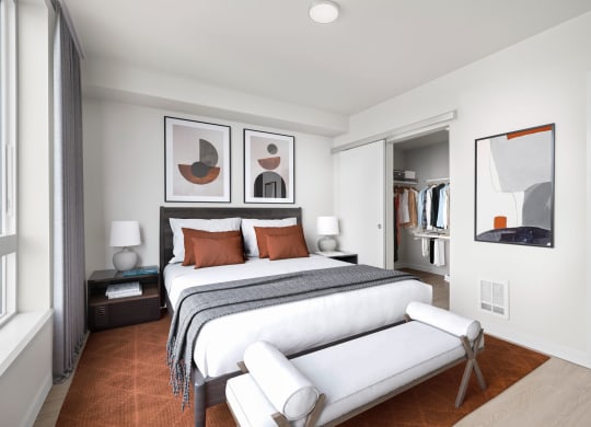 a bedroom with a bed and a chair in a room at Ion Town Center, Shoreline, WA