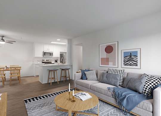A living room with a grey couch and a coffee table.