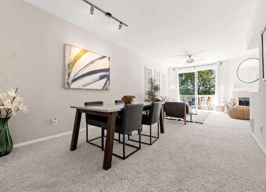 a dining room with a table and chairs