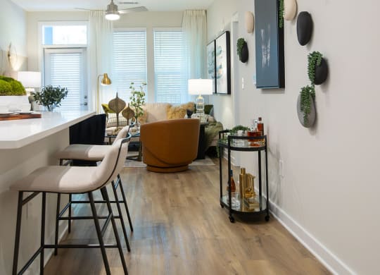 a living room with a couch and a table with chairs