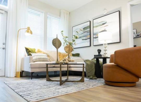 a living room with a couch and a ceiling fan