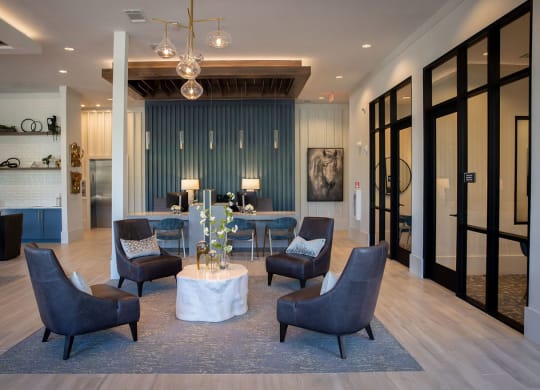 a living room with blue walls and a table with chairs