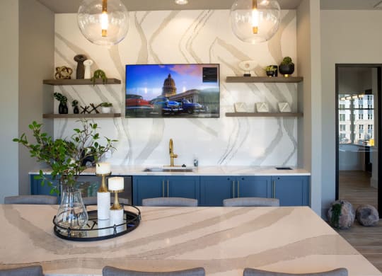 a kitchen or kitchenette with a table and a tv