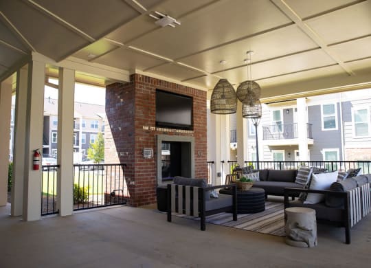 a large living room with couches and a fireplace