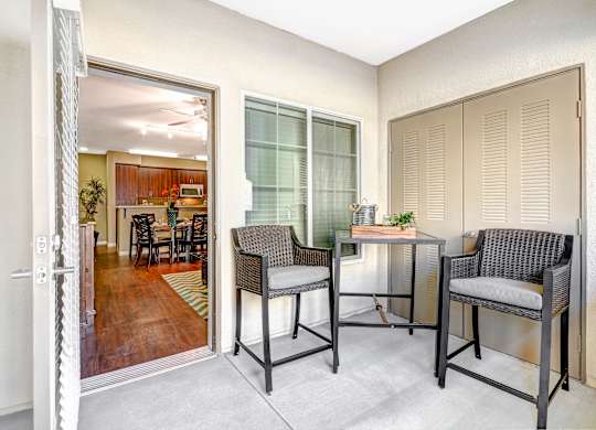 A room with a table and two chairs at Tavera Apartments