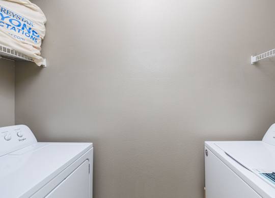 a washer and dryer in a laundry room at Clear Creek Meadows Apartments, Copperas Cove, 76522