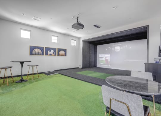 a room with a ping pong table and a projector screen  at Embold, Utah, 84043