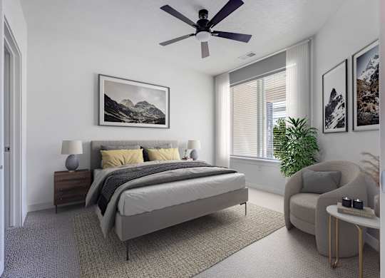 an apartment bedroom with a bed and a ceiling fan