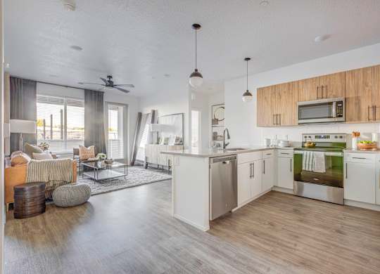 an open kitchen and living room with a view of a living room
